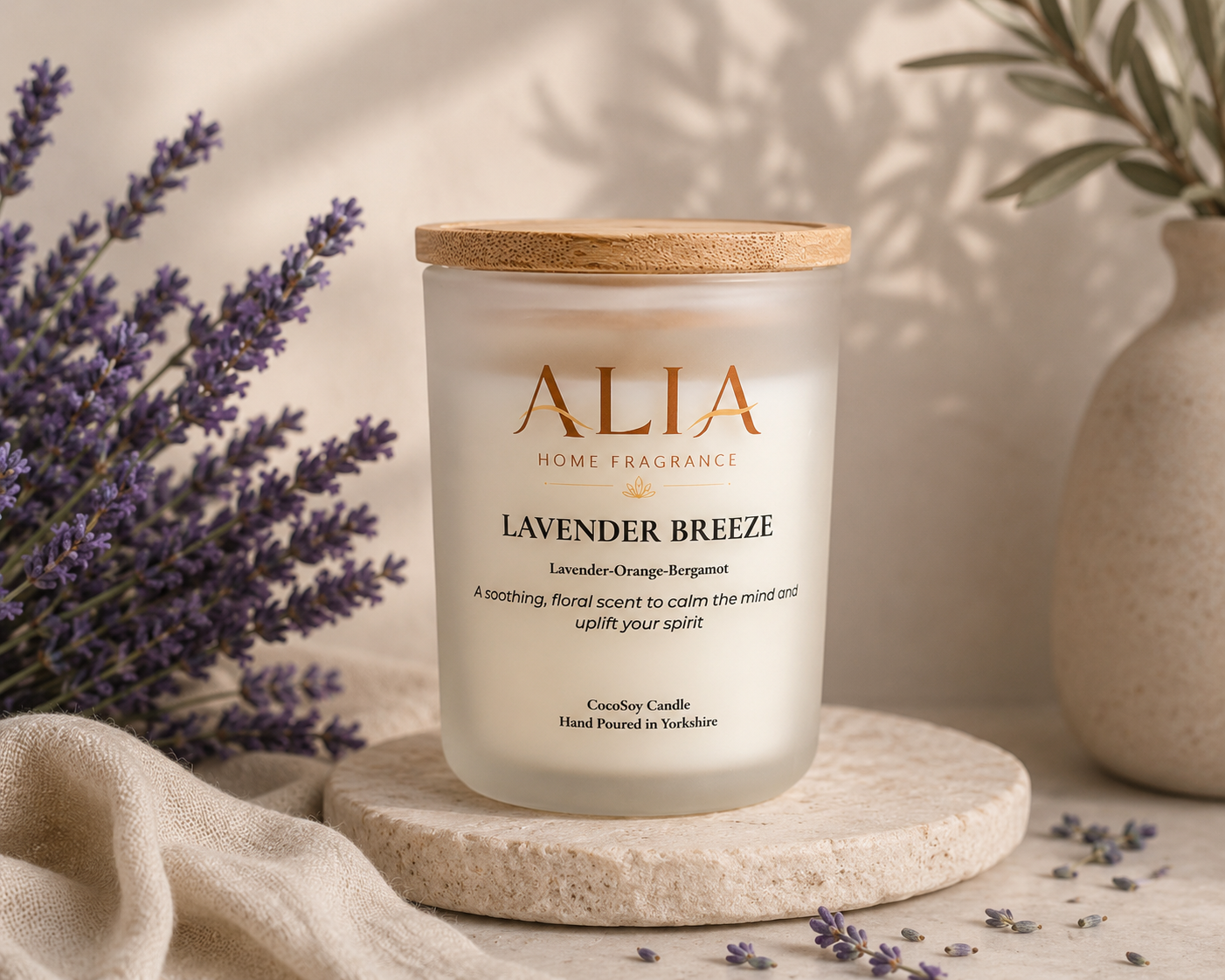 A lavender scented cocosoy candle in a frosted glass jar with bamboo lid