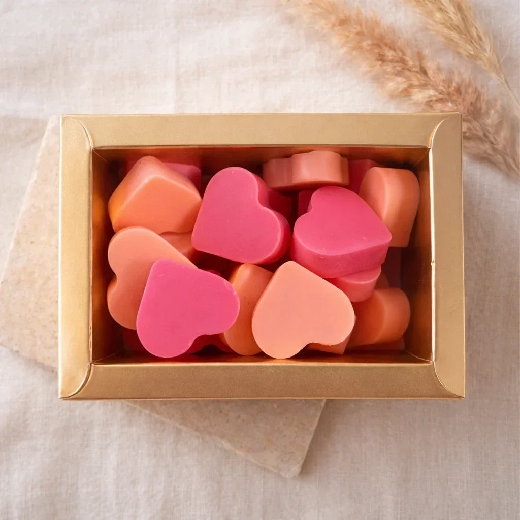 Hand-poured Orange Glow wax melt box (approx. 100g) featuring a vibrant citrus fragrance blend with sweet orange and uplifting zesty notes, vegan-friendly and phthalate-free luxury home fragrance for wax warmers.